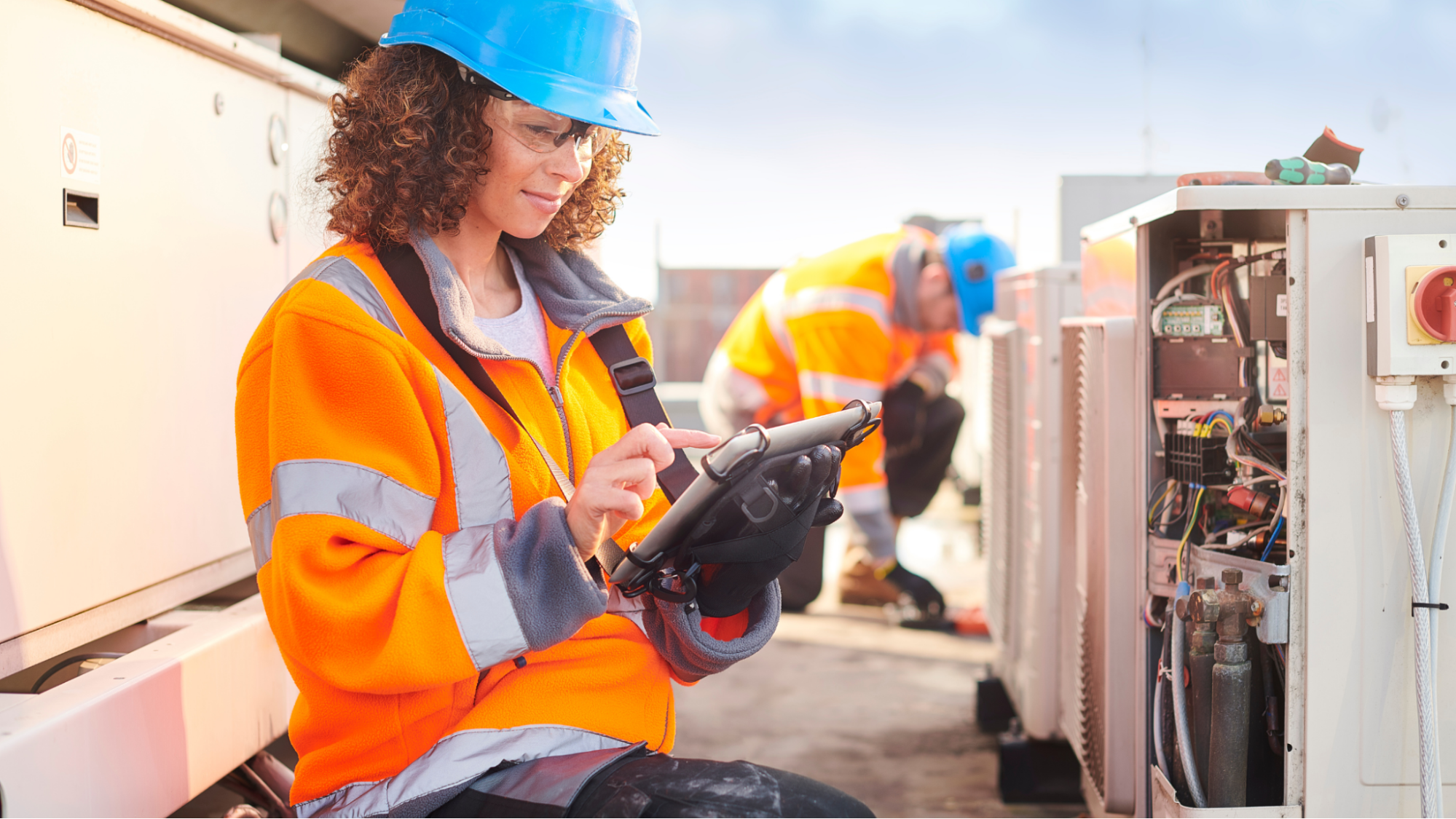 Electrician looking at a tablet