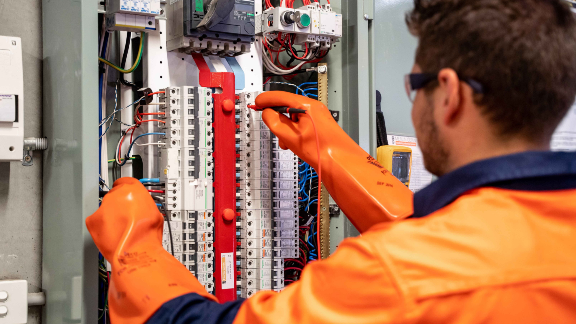 Electrician working on a panel